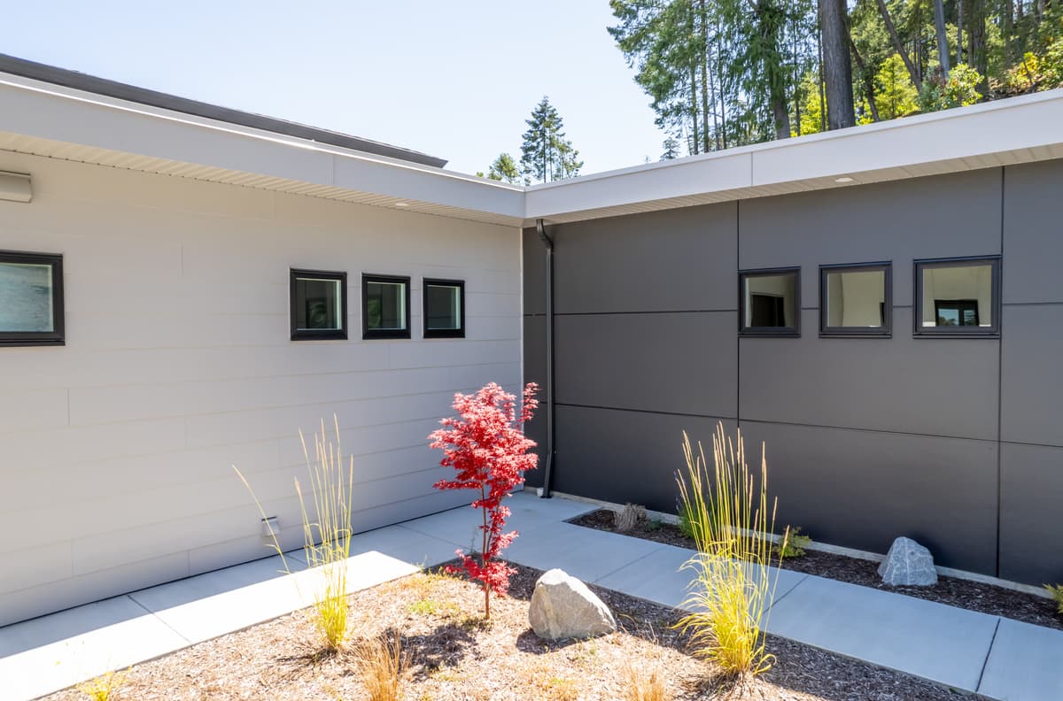 Two-tone Hardie siding with Japanese maple landscaping