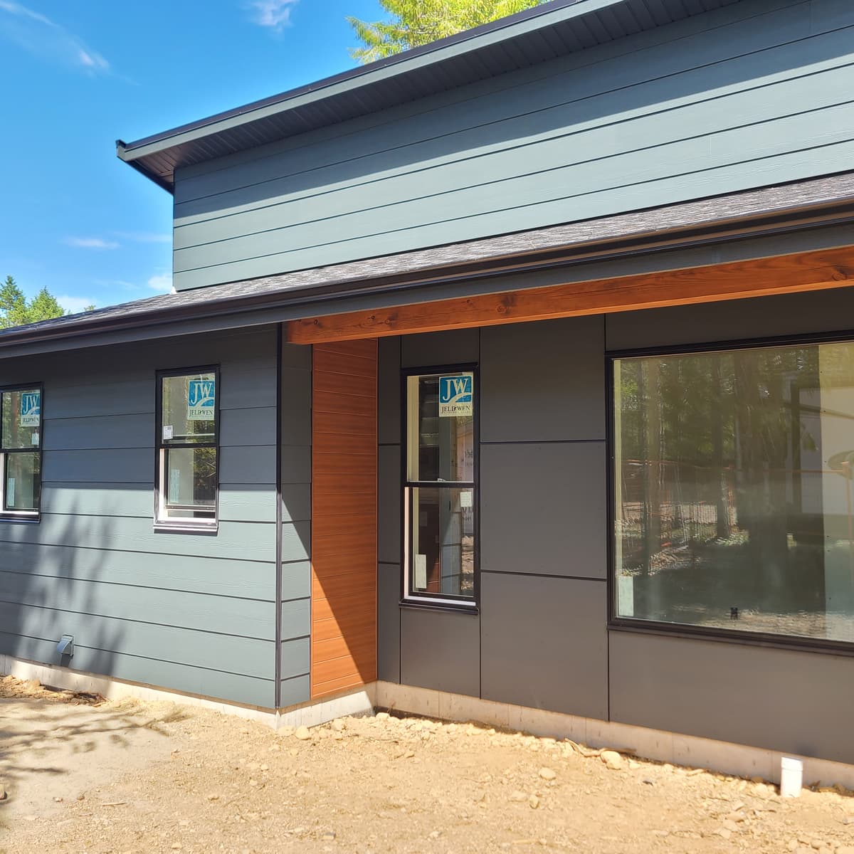 Multi-material exterior with wood accent and panel siding